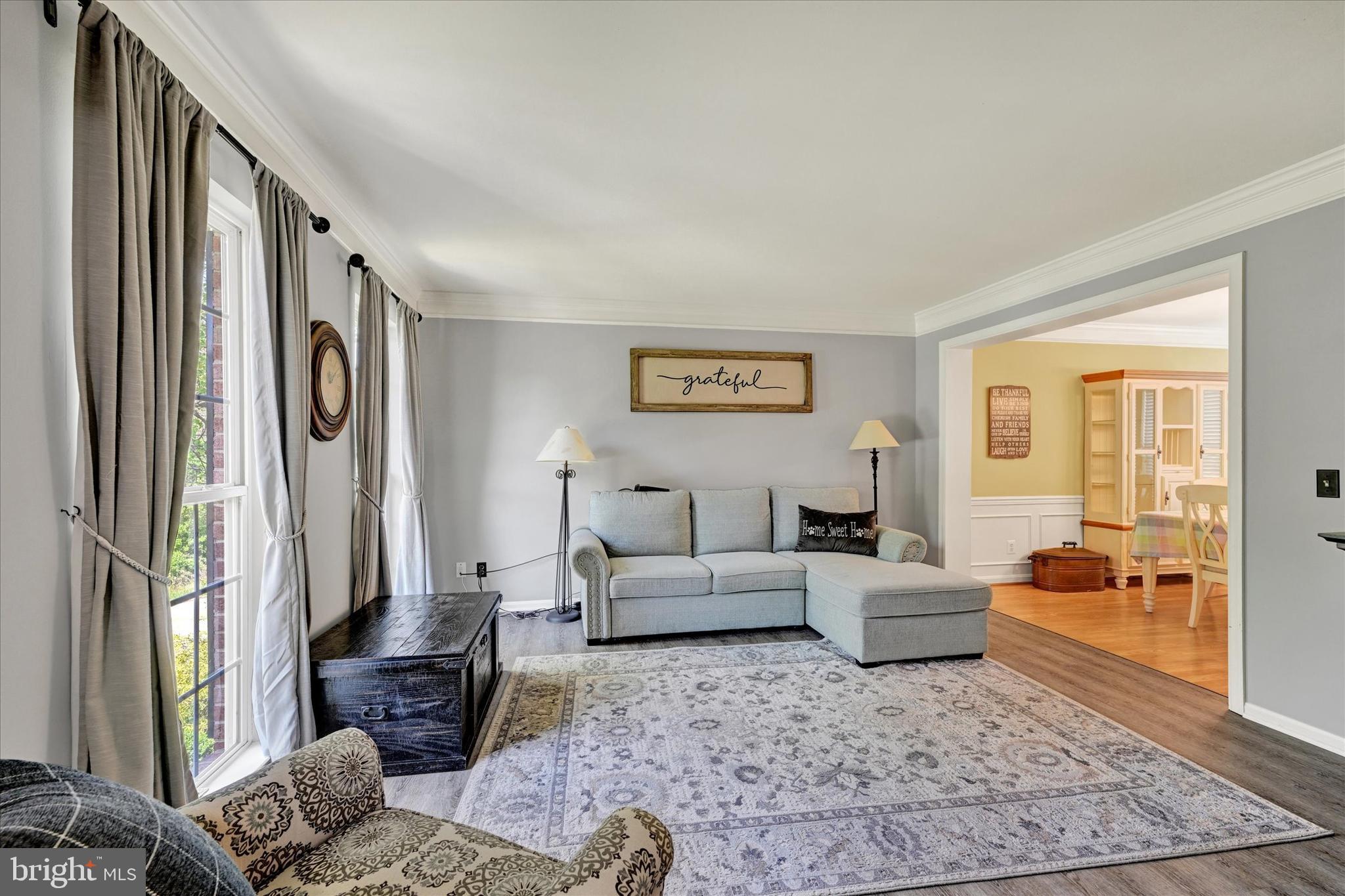 4642 Bucks School House Road Rosedale, MD 21237 - Photo 6 of 33 a living room with furniture and a rug