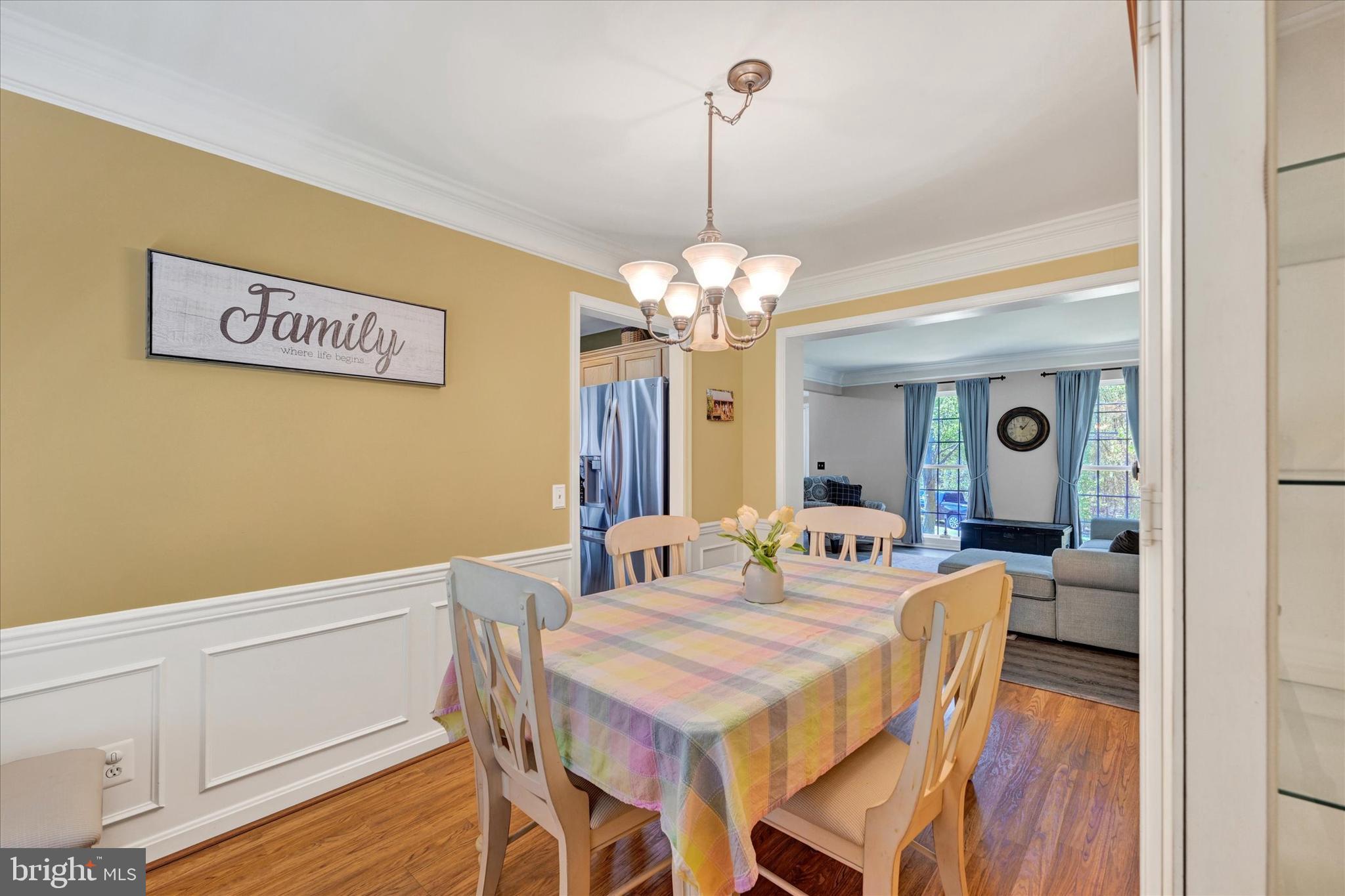 4642 Bucks School House Road Rosedale, MD 21237 - Photo 10 of 33 a view of a dining room with furniture and wooden floor
