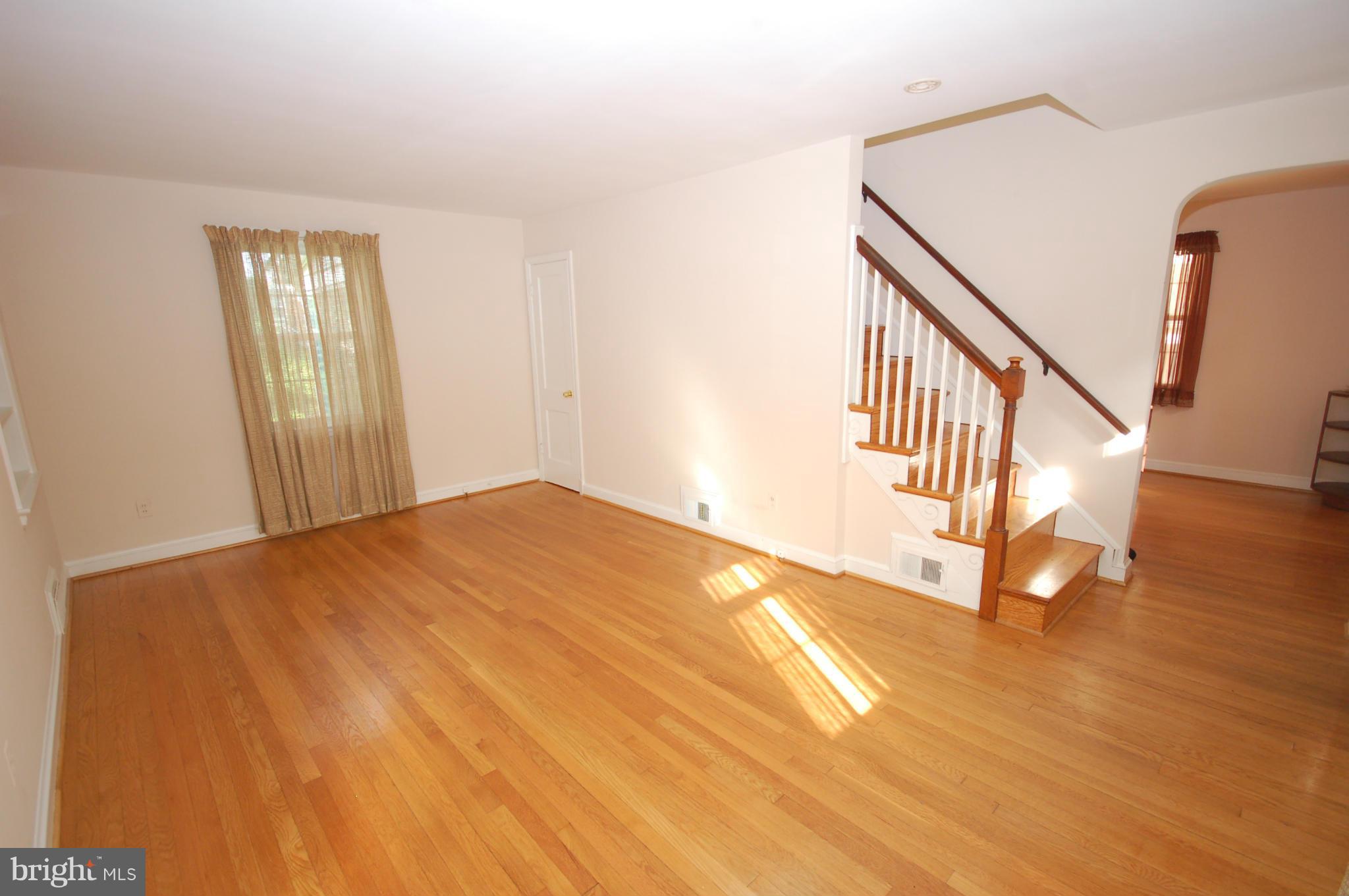 9209 Glenville Road Silver Spring, MD 20901 - Photo 3 of 30 Large living room with built-in bookcase