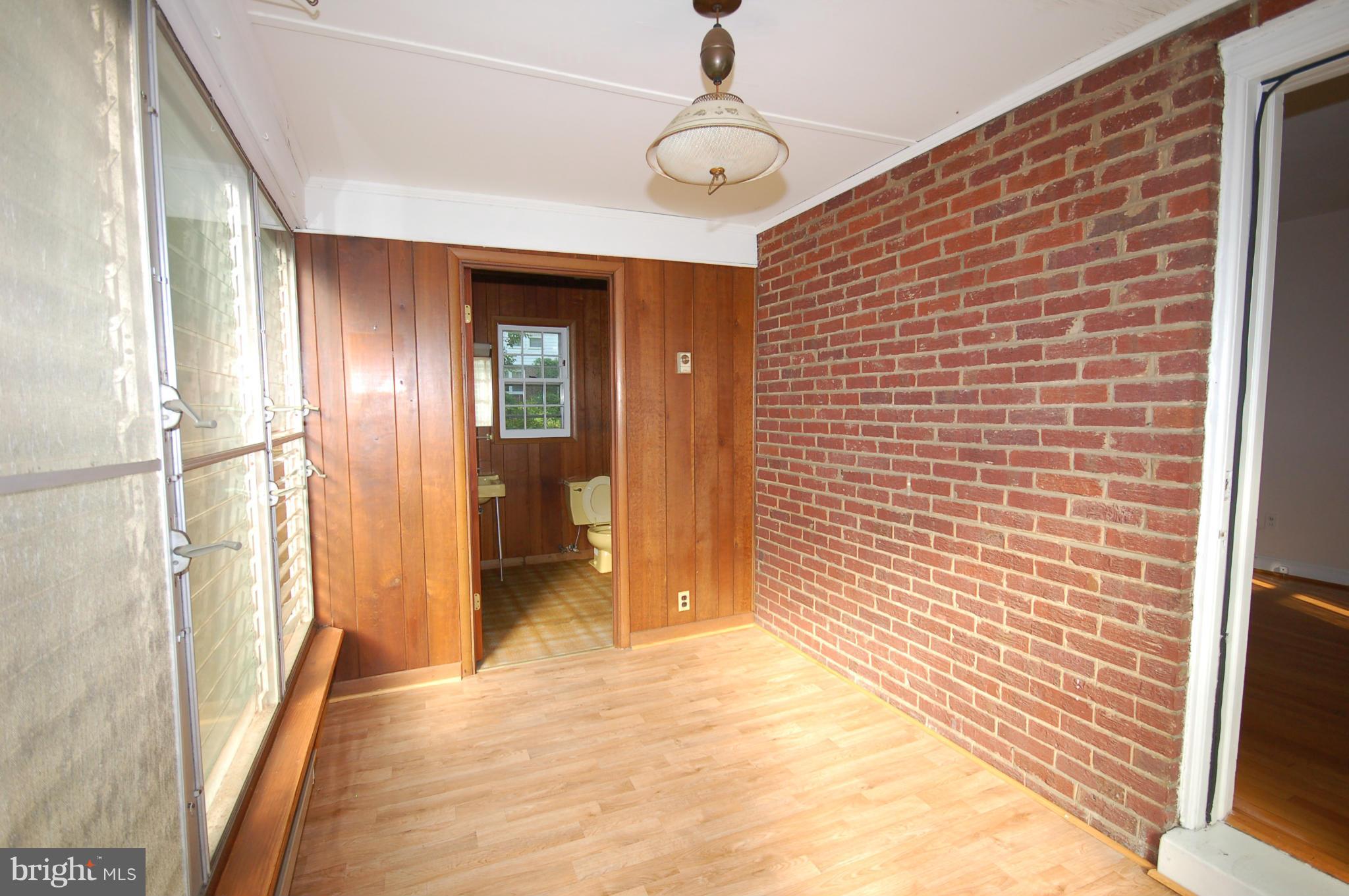9209 Glenville Road Silver Spring, MD 20901 - Photo 7 of 30 Enclosed Side Porch with half bath