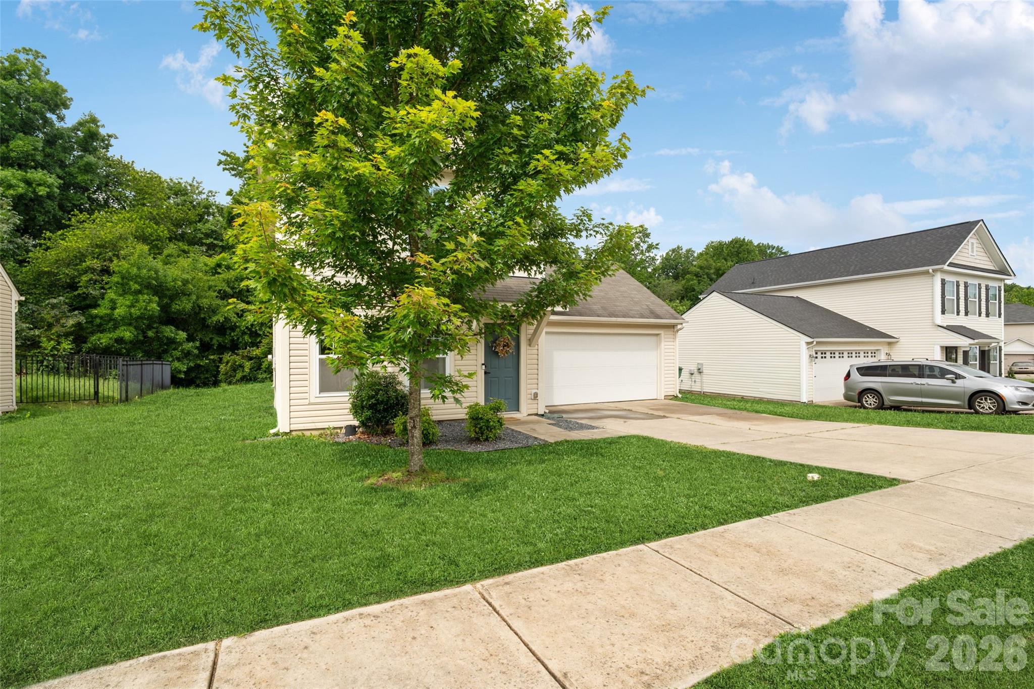 8726 Conrad Street Locust, NC 28097 - Photo 29 of 36 a front view of a house with a yard and trees