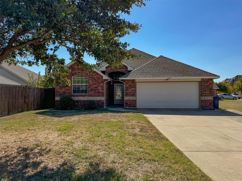 1104 Raleigh Path Denton, TX 76208 - Photo 1 of 1 a front view of a house with yard and tree