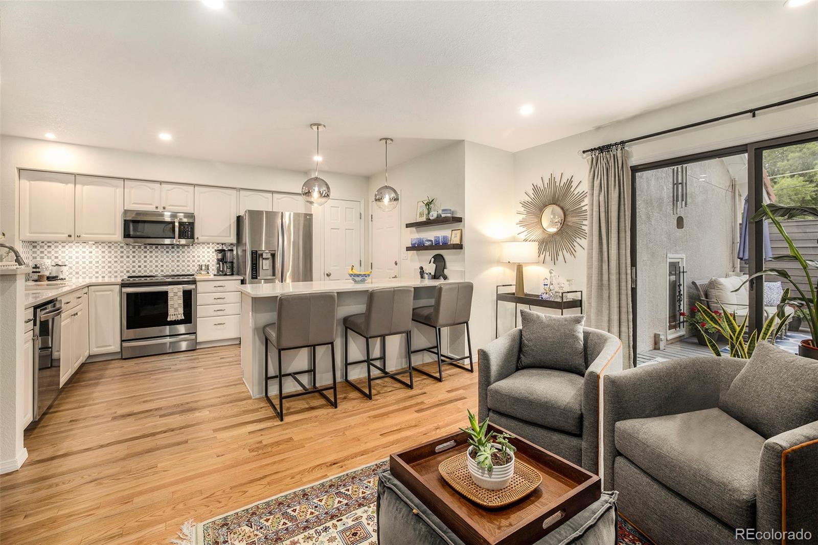 2365 Perry Street Denver, CO 80212 - Photo 12 of 24 a living room with furniture and a wooden floor