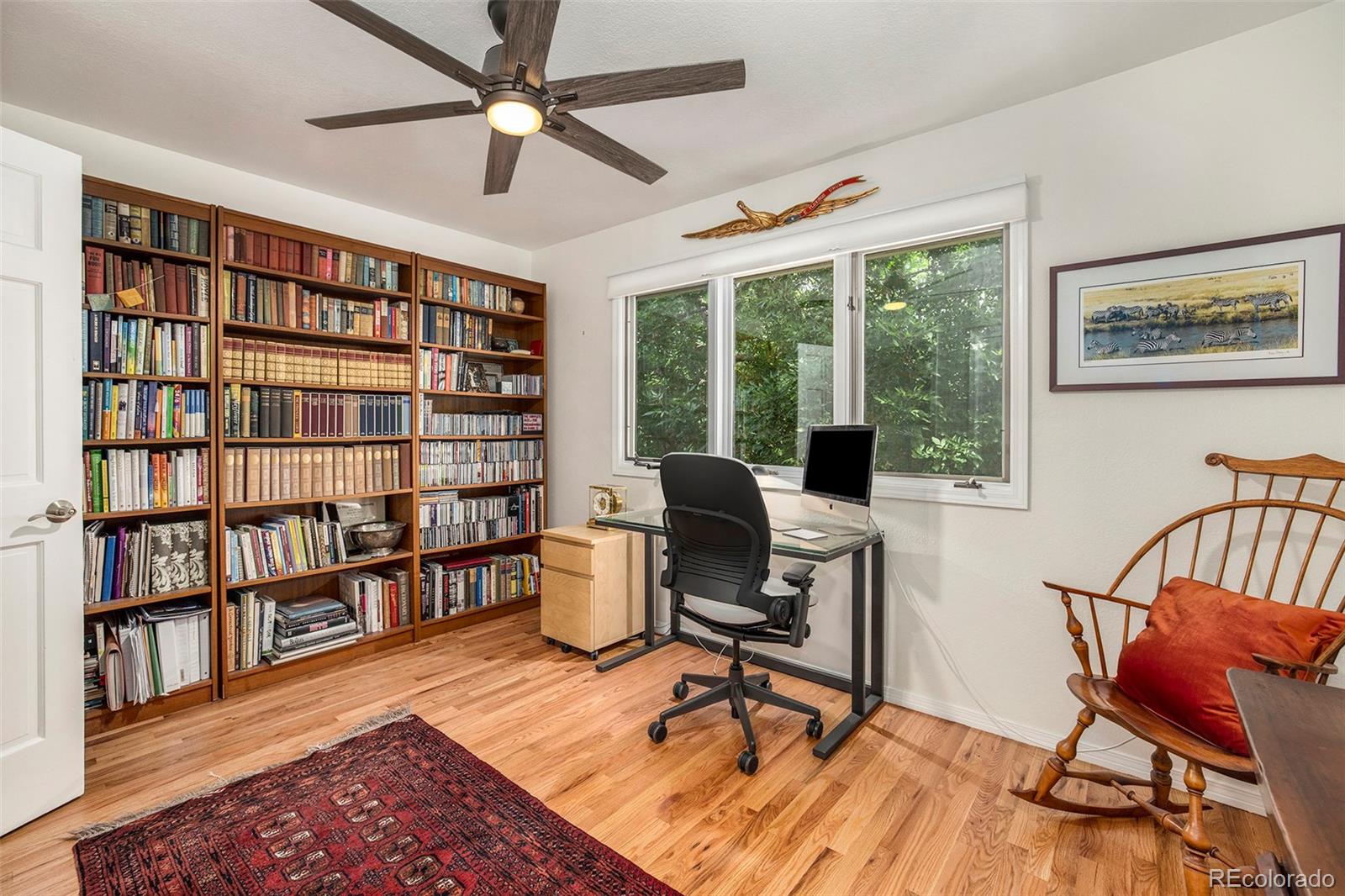 2365 Perry Street Denver, CO 80212 - Photo 18 of 24 a workspace with furniture window and wooden floor