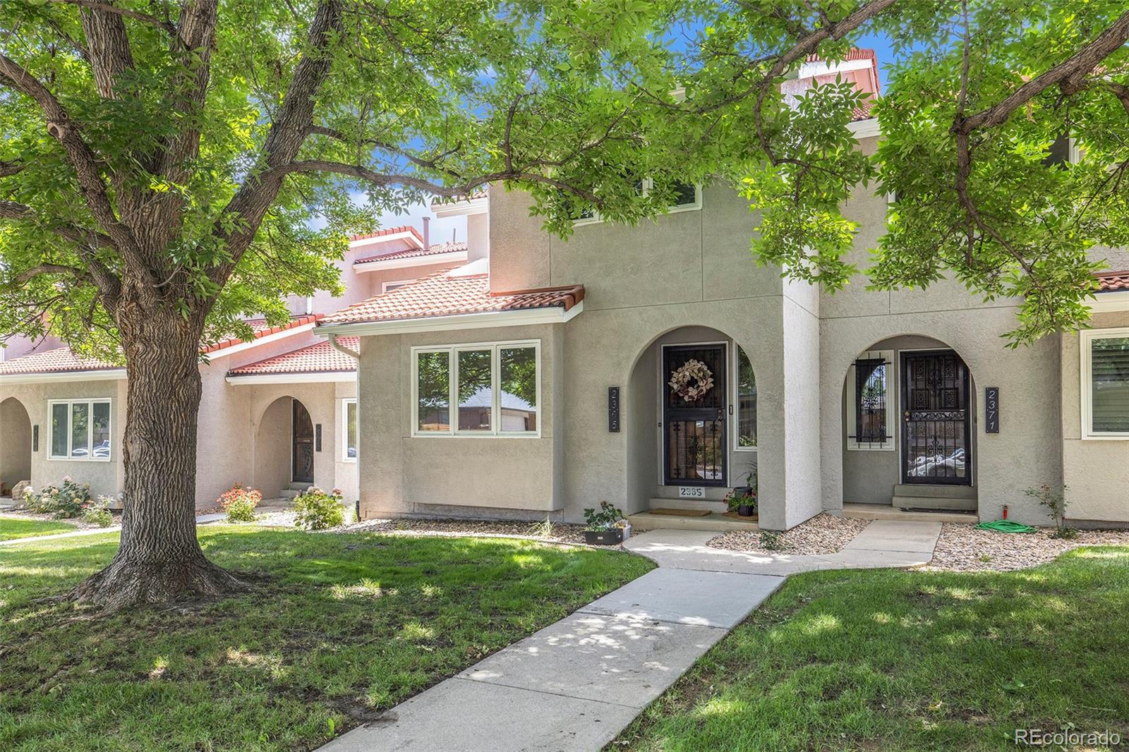 2365 Perry Street Denver, CO 80212 - Photo 2 of 24 a front view of a house with garden