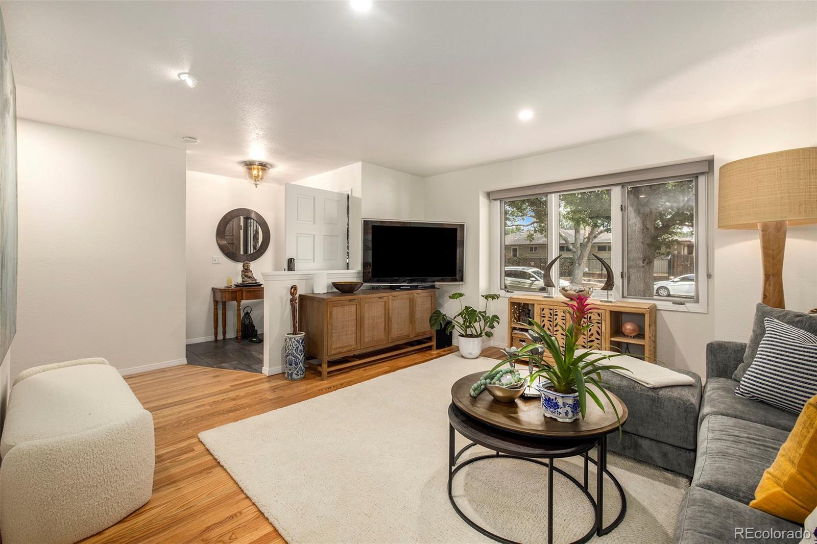 2365 Perry Street Denver, CO 80212 - Photo 4 of 24 a living room with furniture and a flat screen tv