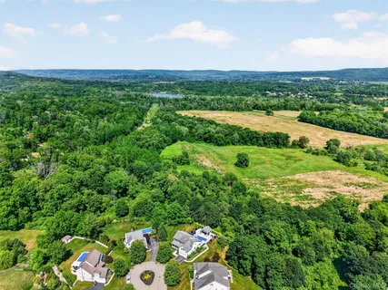 an aerial view of a house with outdoor space