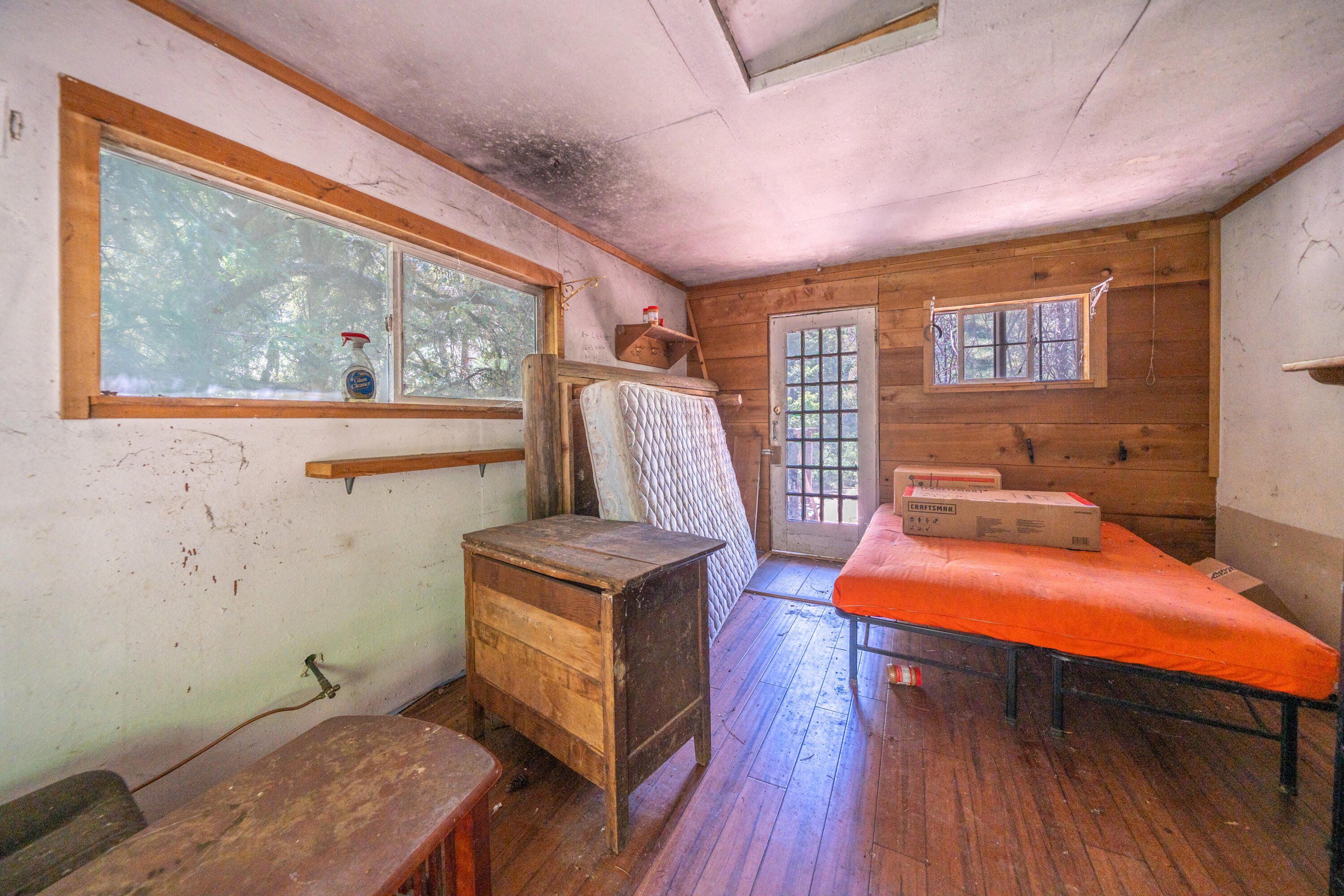 0 East Fork Road French Gulch, CA 96033 - Photo 12 of 78 a bedroom with a bed and wooden floor