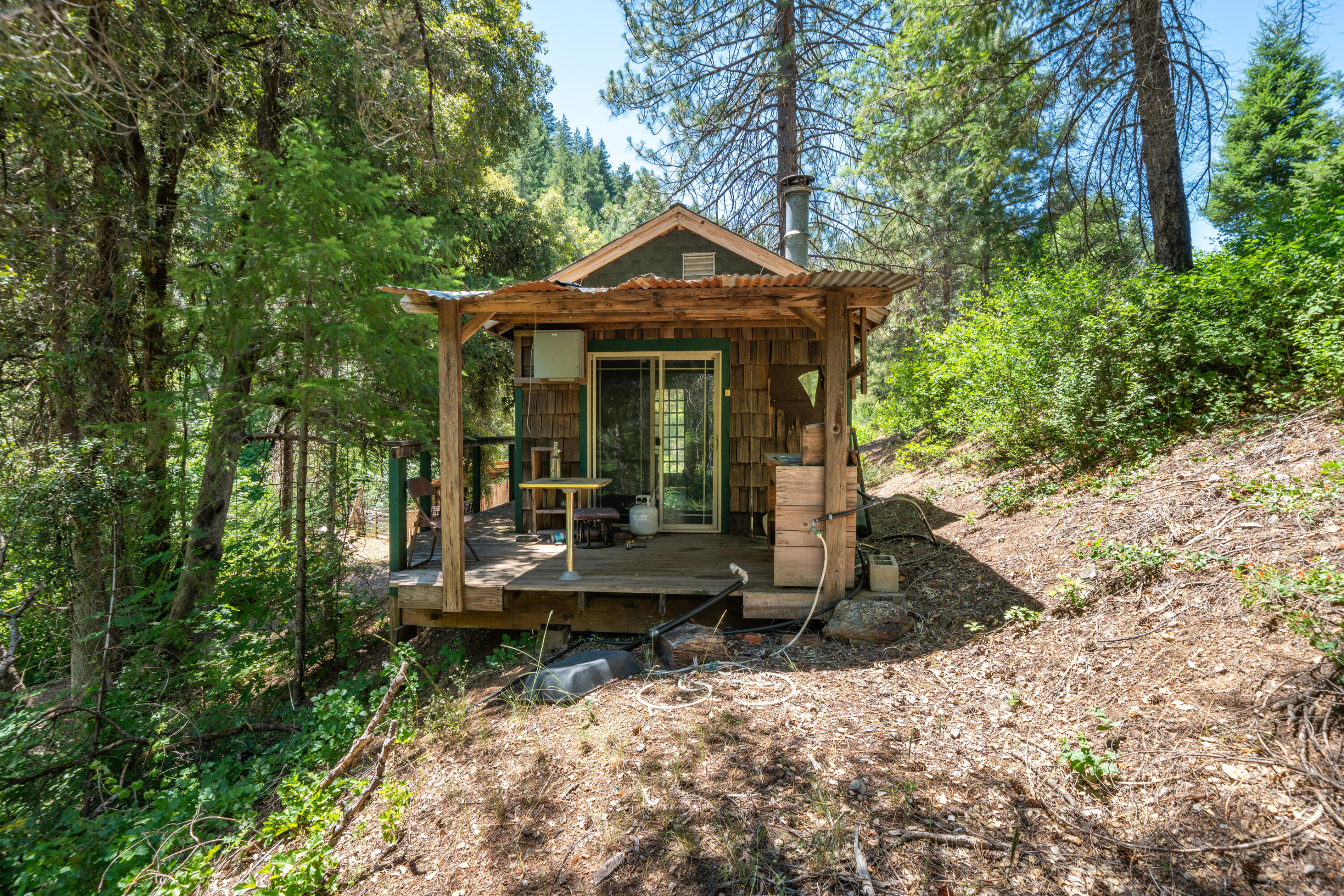 0 East Fork Road French Gulch, CA 96033 - Photo 15 of 78 a front view of a house with garden