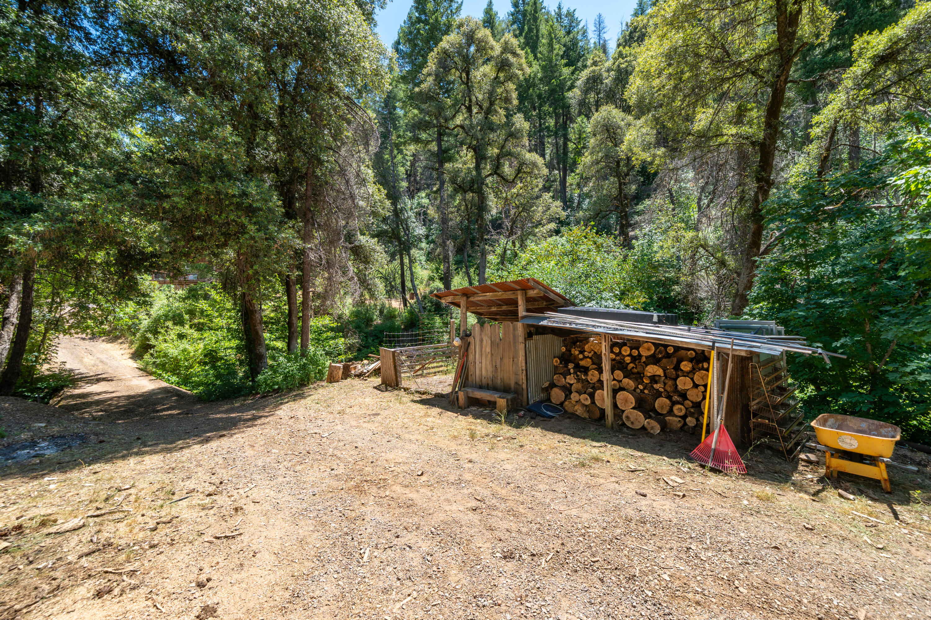 0 East Fork Road French Gulch, CA 96033 - Photo 16 of 78 a view of a wooden fence with trees in the background