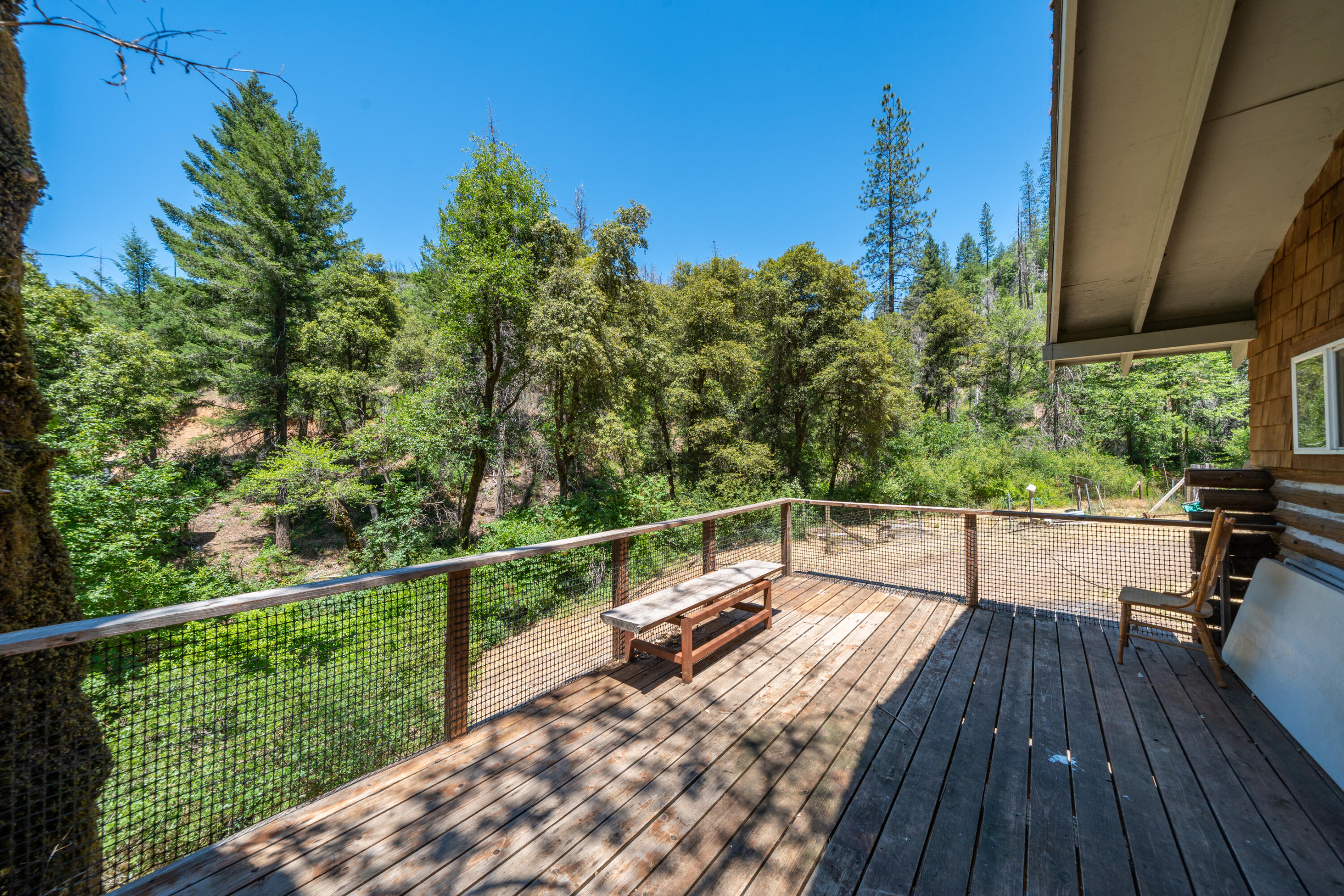 0 East Fork Road French Gulch, CA 96033 - Photo 33 of 78 a view of balcony with wooden floor and outdoor seating