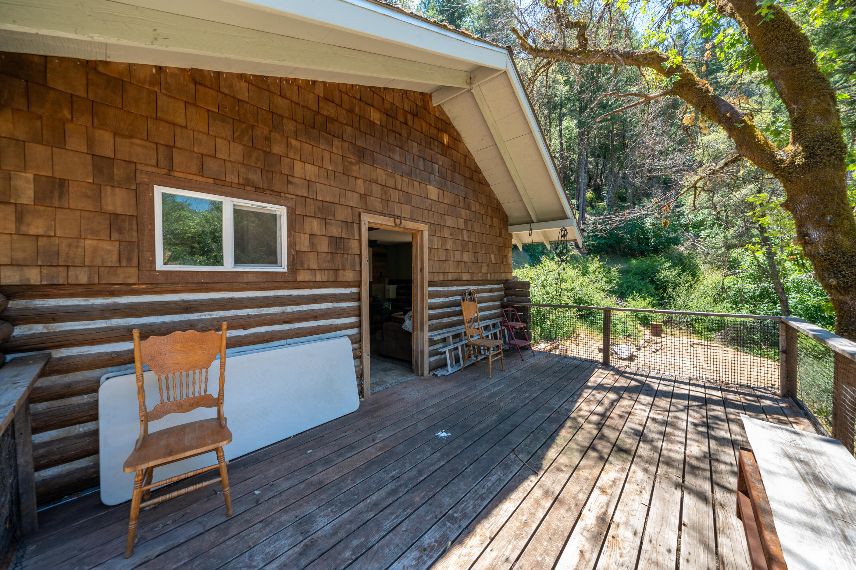 0 East Fork Road French Gulch, CA 96033 - Photo 34 of 78 a backyard of a house with barbeque oven table and chairs