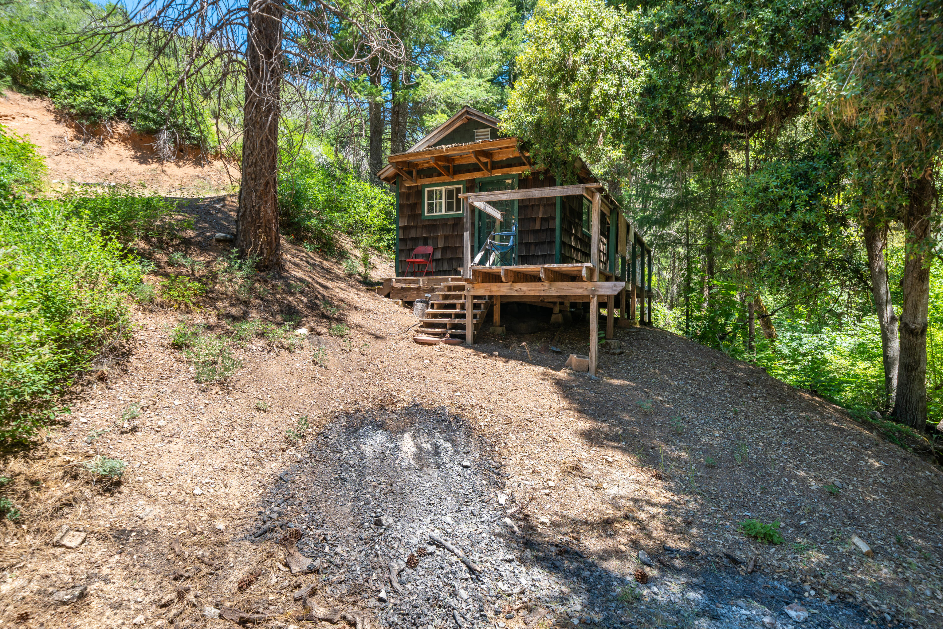 0 East Fork Road French Gulch, CA 96033 - Photo 9 of 78 a view of a patio with a table and chairs under an umbrella