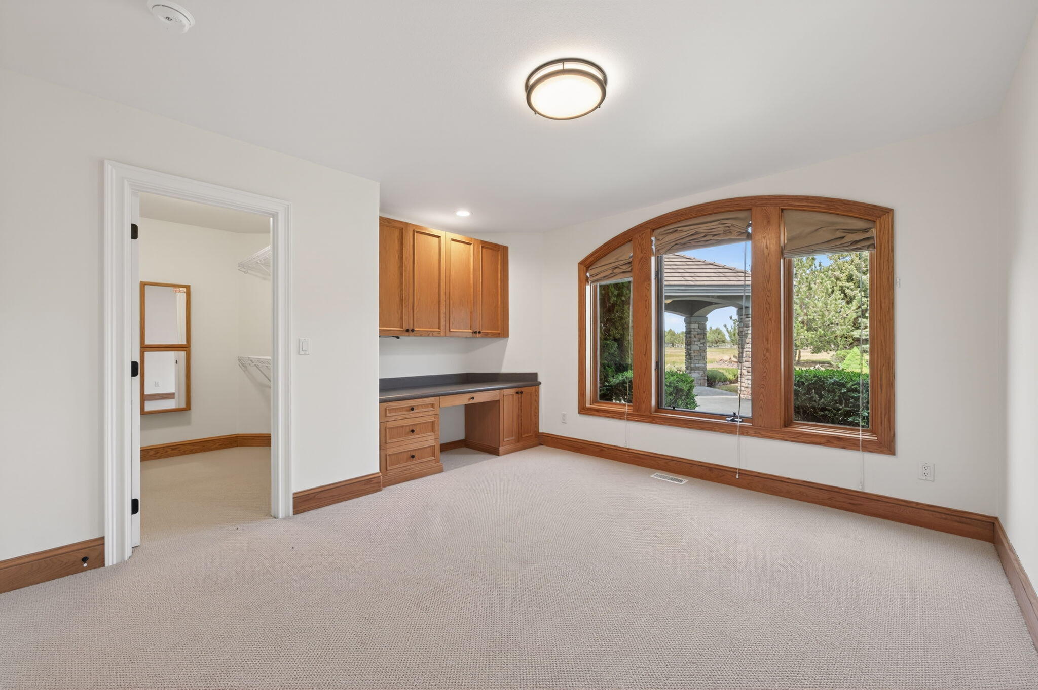 20180 Winston Loop Bend, OR 97703 - Photo 26 of 59 a view of an empty room with a window and a kitchen