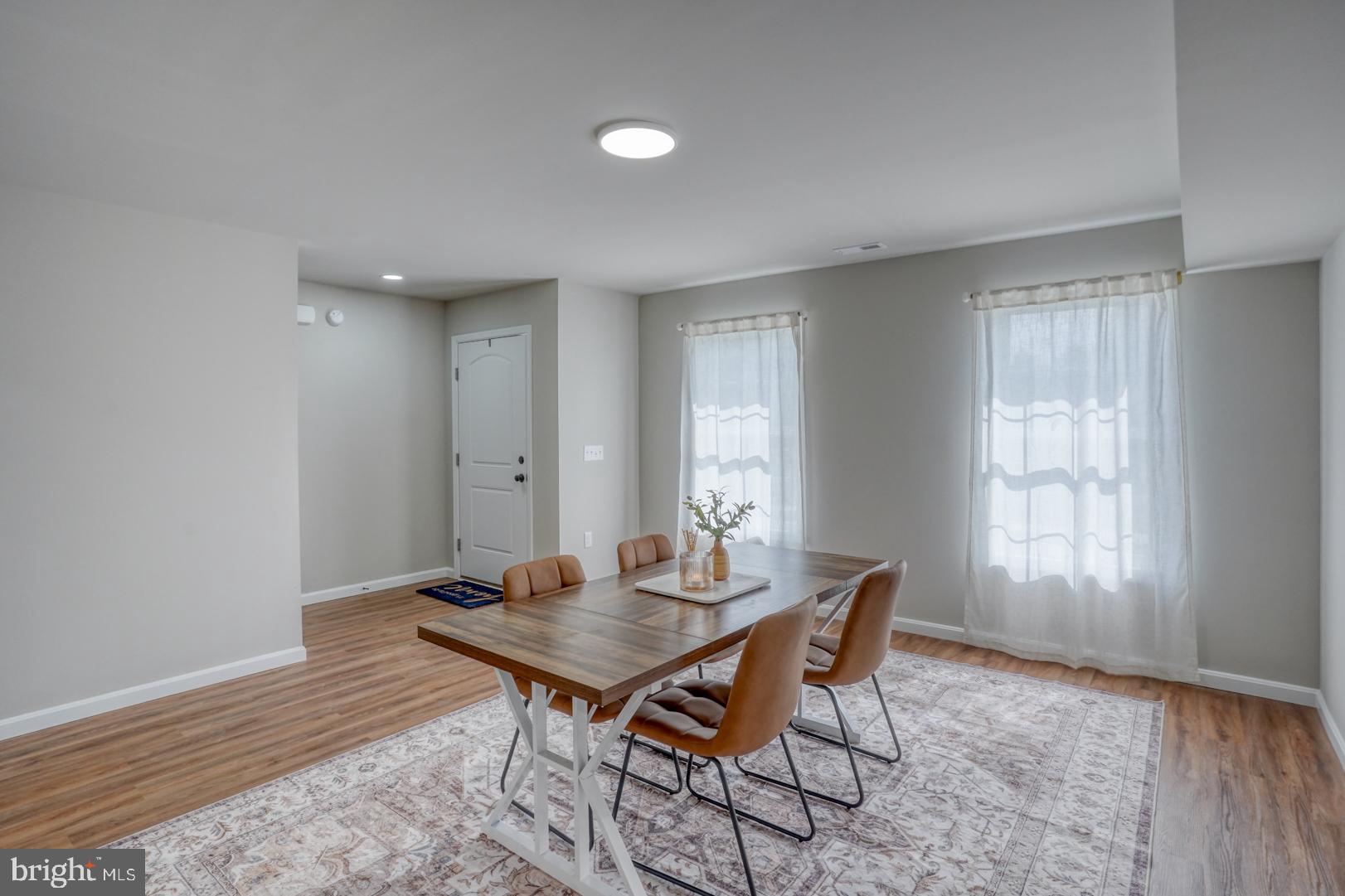 236 Rojan Road Dover, DE 19901 - Photo 3 of 17 a view of a dining room with furniture and wooden floor