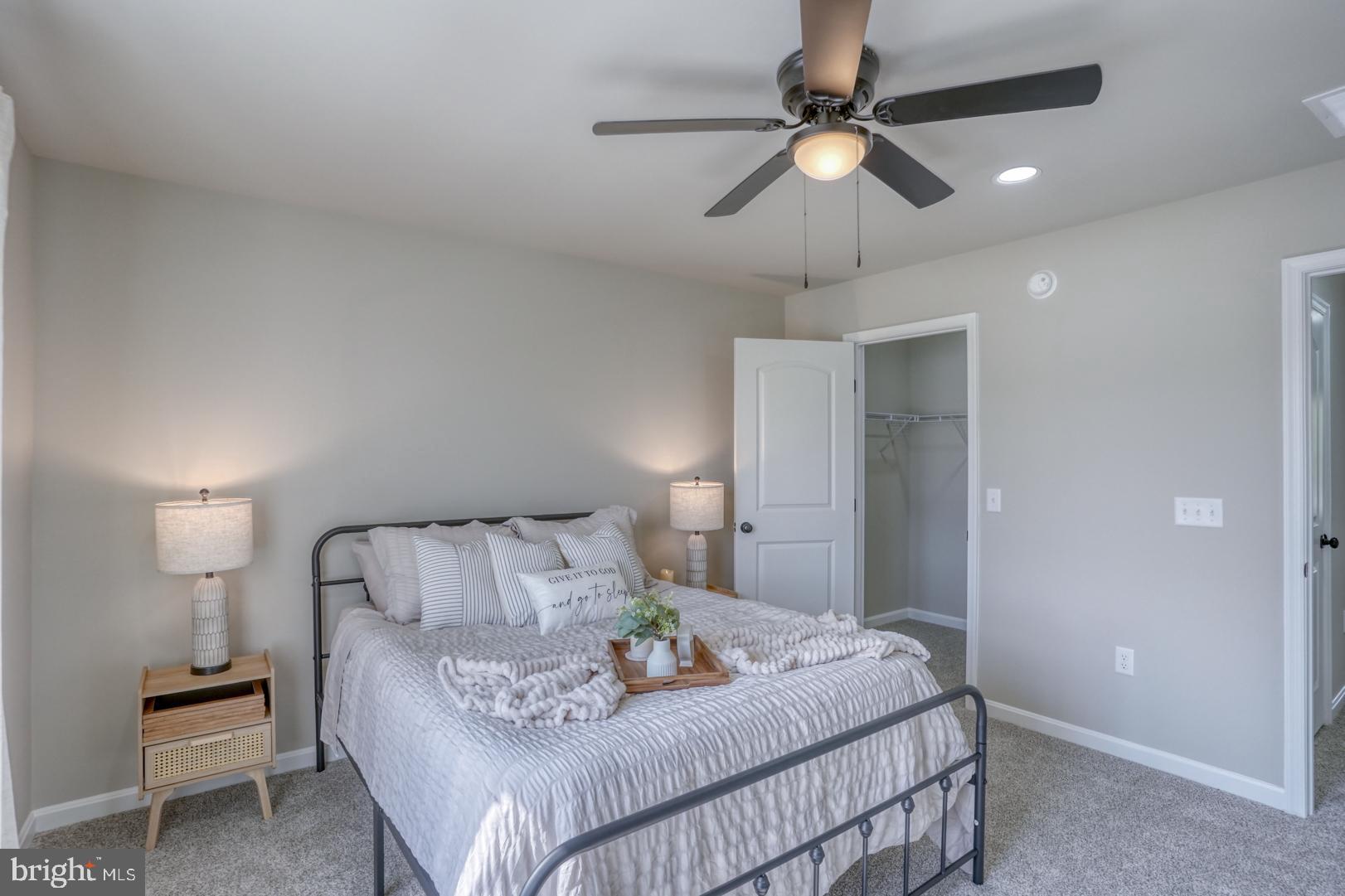 236 Rojan Road Dover, DE 19901 - Photo 5 of 17 a bedroom with a bed and a chandelier