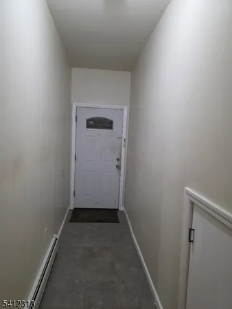 an empty room with wooden floor