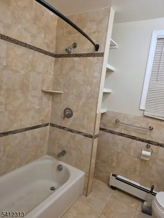 a bathroom with a bath tub and a shower