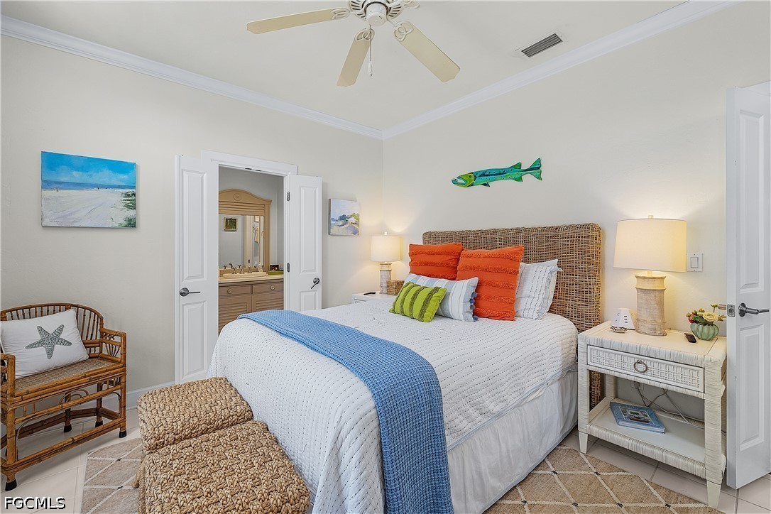 515 Useppa Useppa Island Bokeelia, FL 33922 - Photo 23 of 43 a bedroom with a bed and a chandelier
