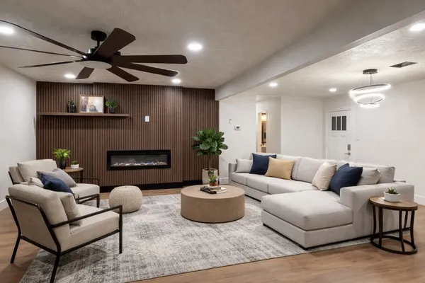 a living room with furniture and a fireplace