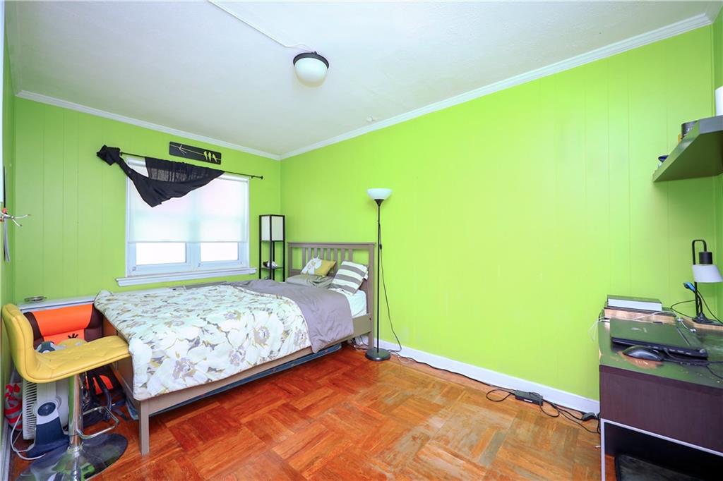 3098 Nostrand Avenue Brooklyn, NY 11229 - Photo 13 of 17 a bedroom with a bed and a dresser