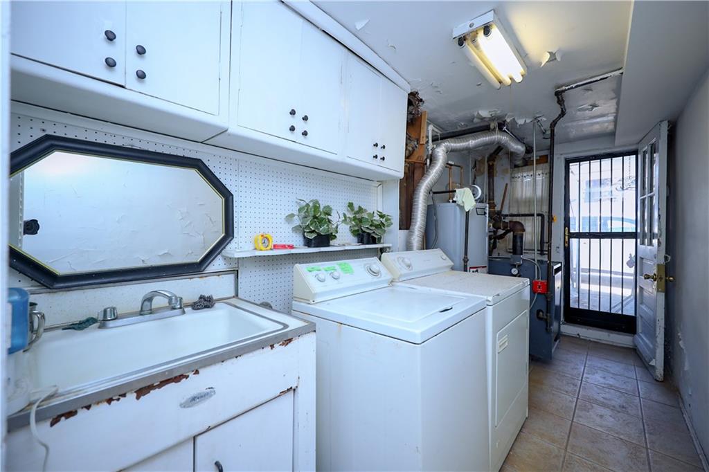3098 Nostrand Avenue Brooklyn, NY 11229 - Photo 16 of 17 a bathroom with a sink vanity and mirror
