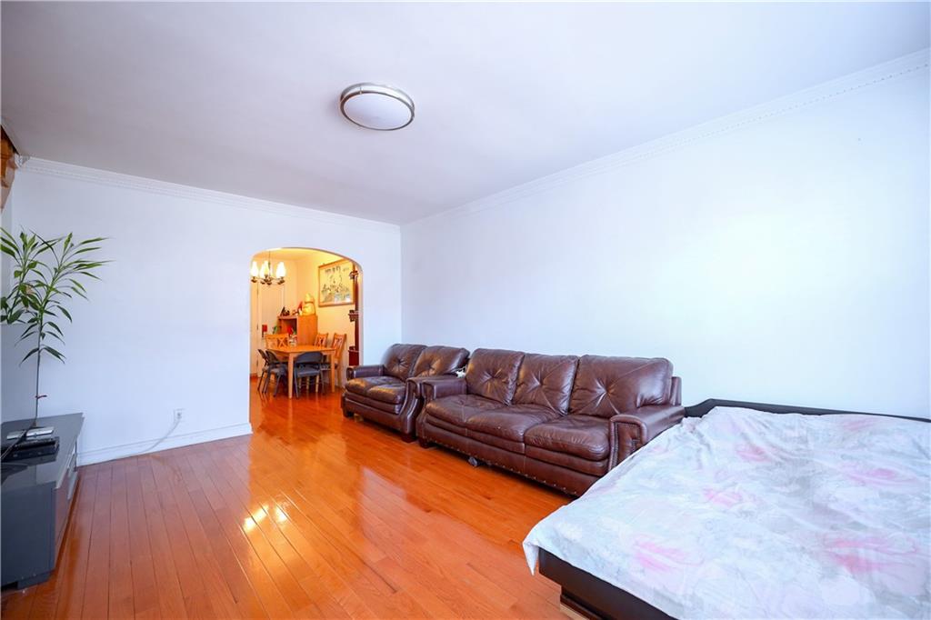 3098 Nostrand Avenue Brooklyn, NY 11229 - Photo 5 of 17 a living room with furniture and a wooden floor