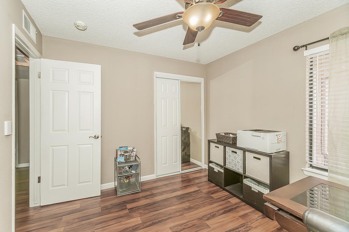 1908 East Niles Avenue Fresno, CA 93720 - Photo 22 of 30 a view of a hallway with wooden floor and staircase