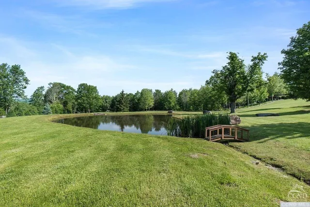 a swimming pool with wooden fence