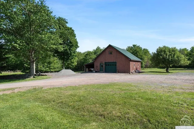 a front view of house with yard and green space