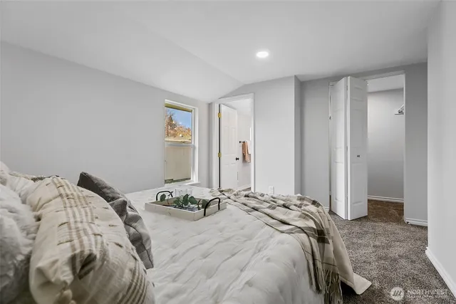 a bedroom with a bed and a cabinets