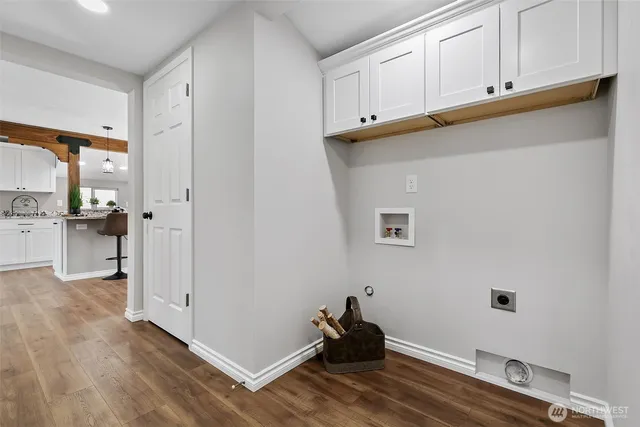 a view of a kitchen with wooden floor