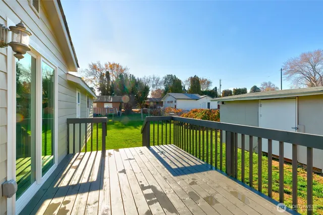 a view of a deck with a yard