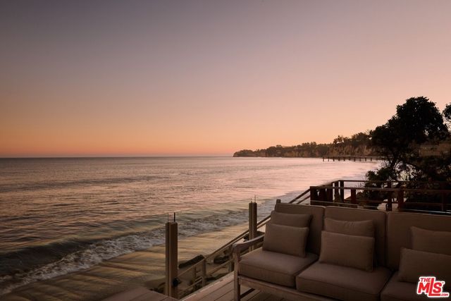 a view of a chairs and table on the terrace