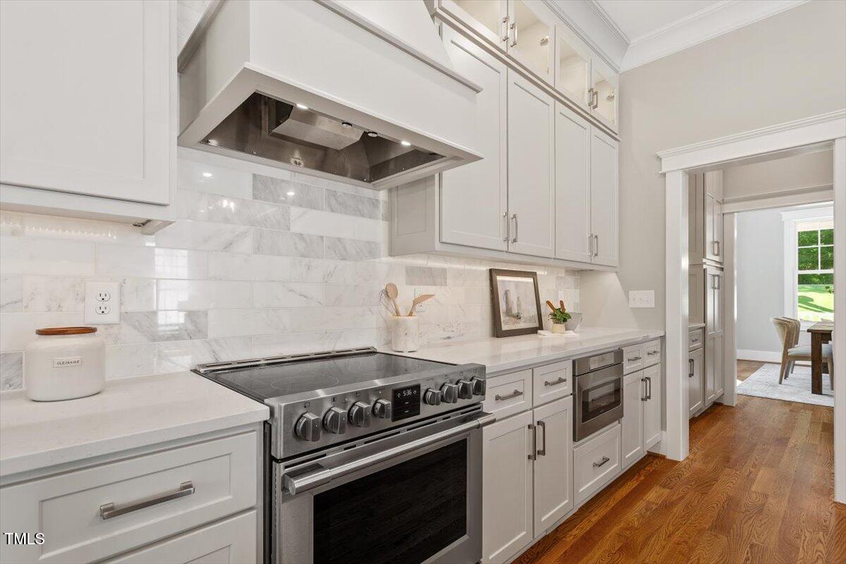 3932 Old Chapel Hill Road Durham, NC 27707 - Photo 18 of 46 a white stove top oven sitting inside of a kitchen