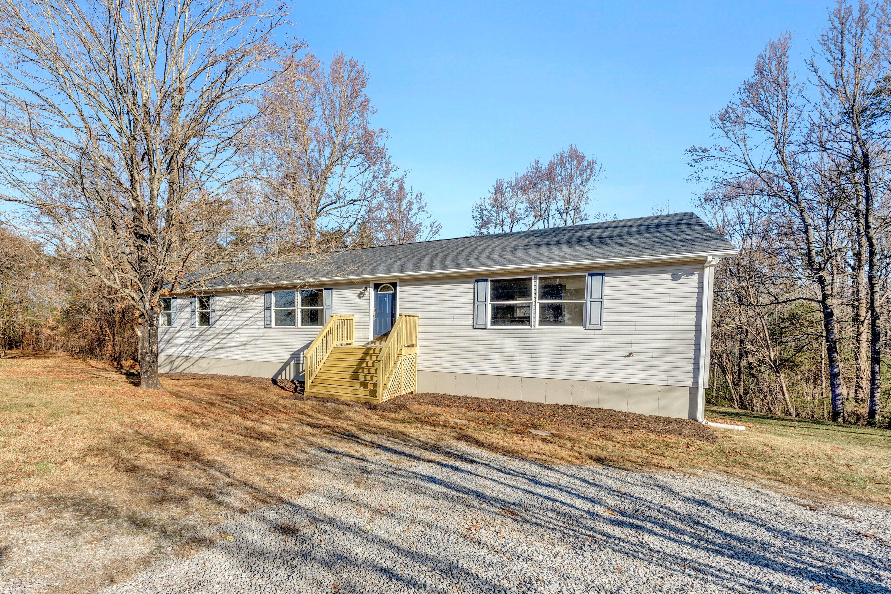 391 Jamestown Road Rocky Mount, VA 24151 - Photo 1 of 40 a front view of a house with a yard covered in snow