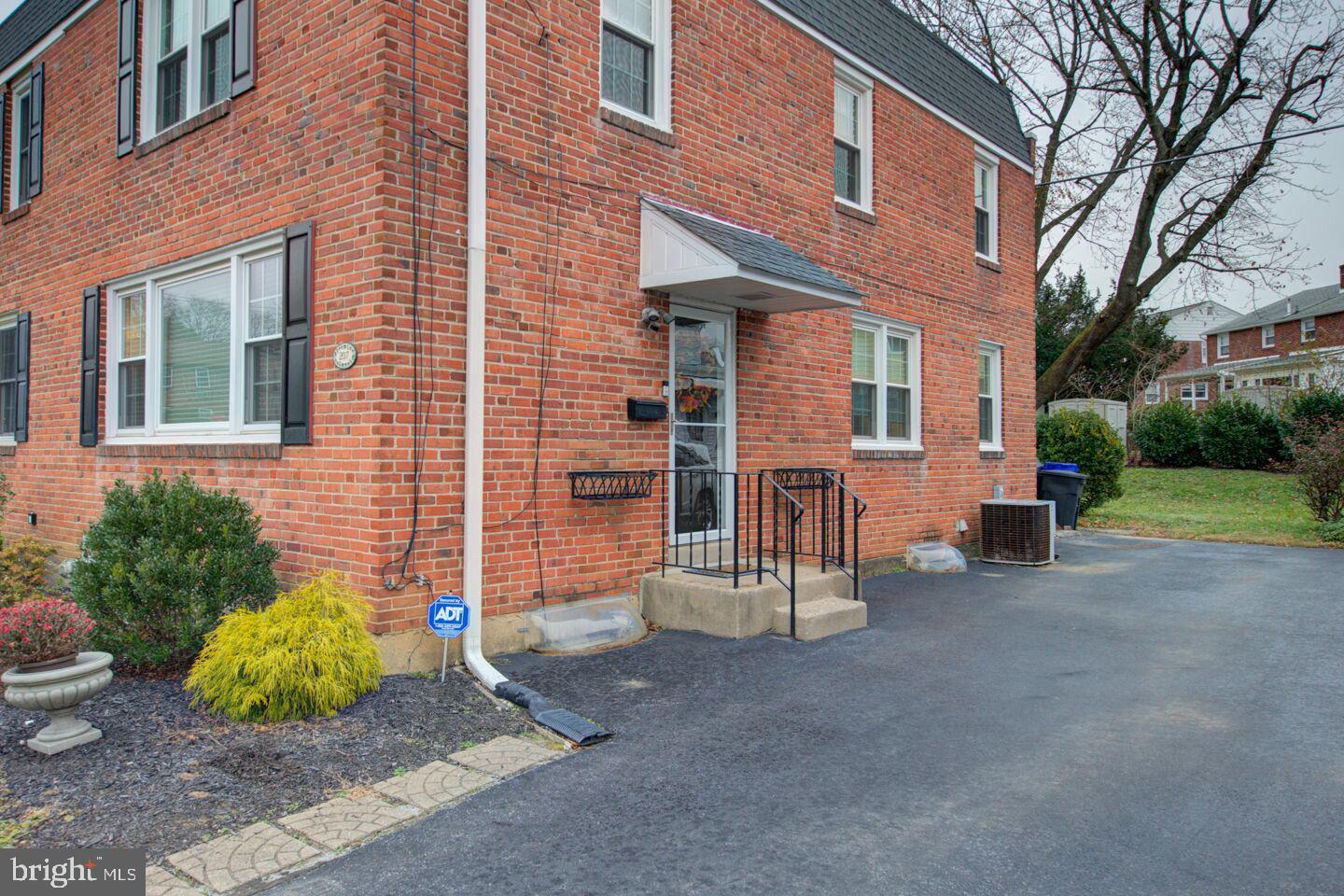 207 Fitzwilliams Road Bryn Mawr, PA 19010 - Photo 3 of 26 a view of a house with a patio and a yard