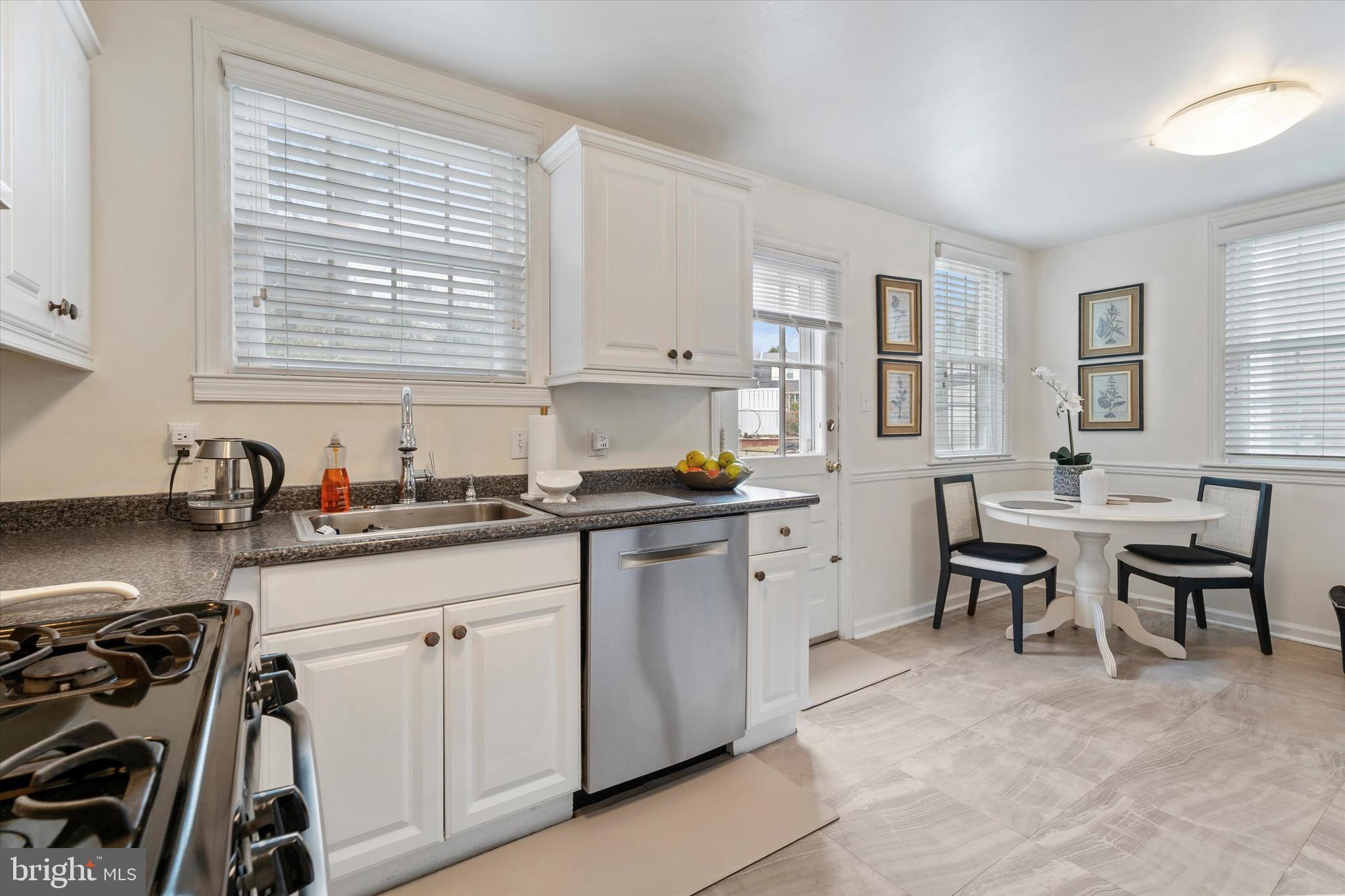 207 Fitzwilliams Road Bryn Mawr, PA 19010 - Photo 10 of 26 a kitchen with a sink and a stove top oven