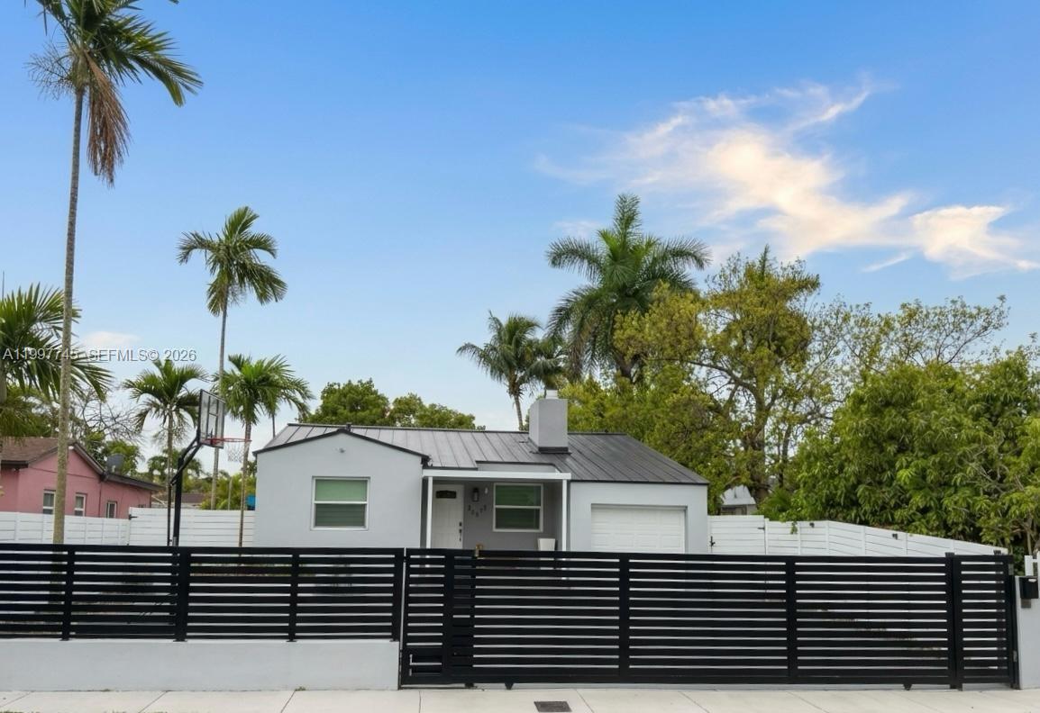 2376 Northwest 2nd Street Miami, FL 33125 - Photo 2 of 77 a house view with a garden space