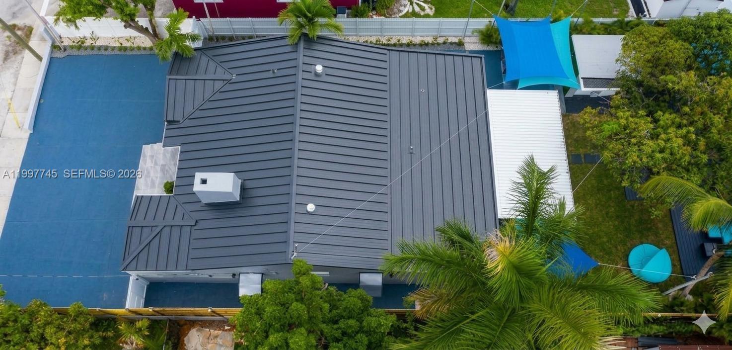 2376 Northwest 2nd Street Miami, FL 33125 - Photo 40 of 77 a view of a backyard with plants and a house