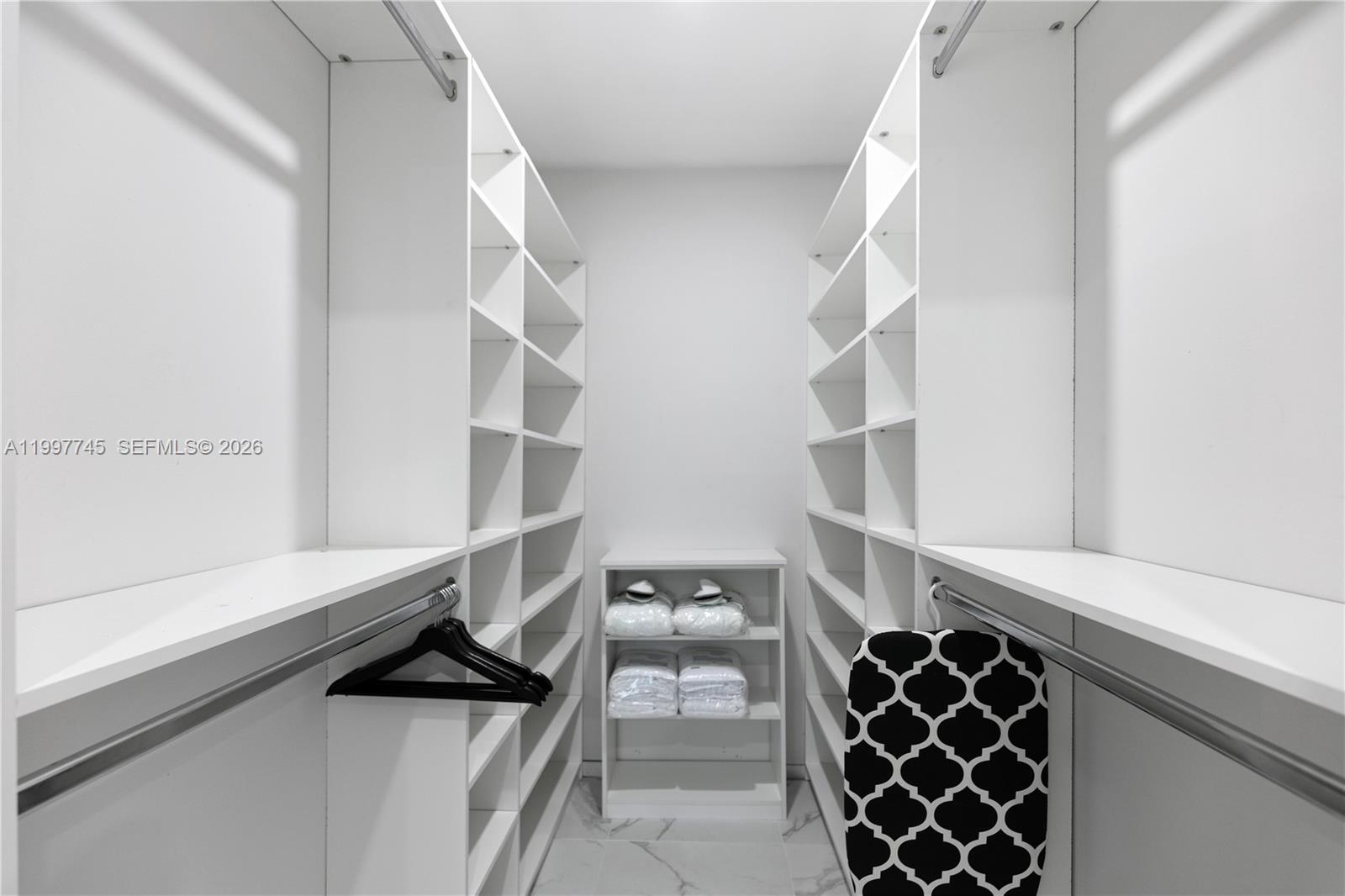 2376 Northwest 2nd Street Miami, FL 33125 - Photo 46 of 77 a view of walk in closet with empty racks
