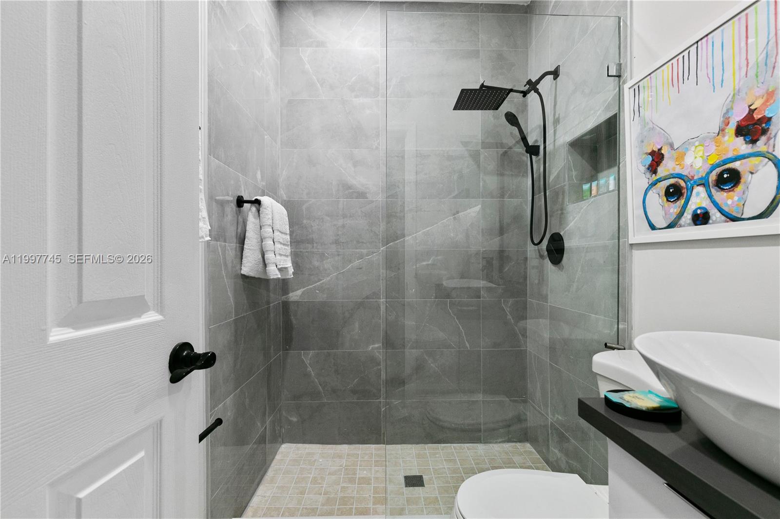 2376 Northwest 2nd Street Miami, FL 33125 - Photo 71 of 77 a bathroom with a shower toilet and a sink
