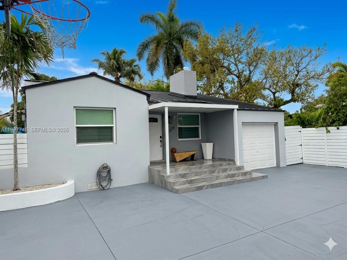 2376 Northwest 2nd Street Miami, FL 33125 - Photo 76 of 77 a view of a house with backyard and sitting area
