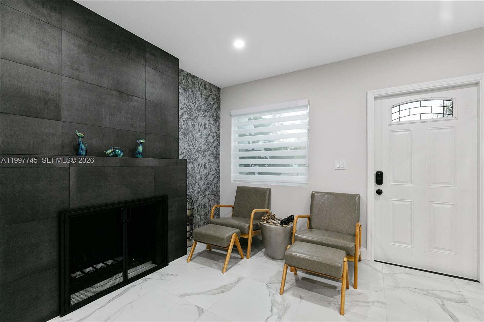 2376 Northwest 2nd Street Miami, FL 33125 - Photo 9 of 77 a living room with furniture a window and a fireplace