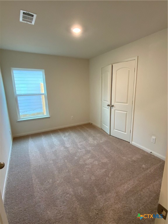 208 Allington Circle Jarrell, TX 76537 - Photo 12 of 16 an empty room with windows
