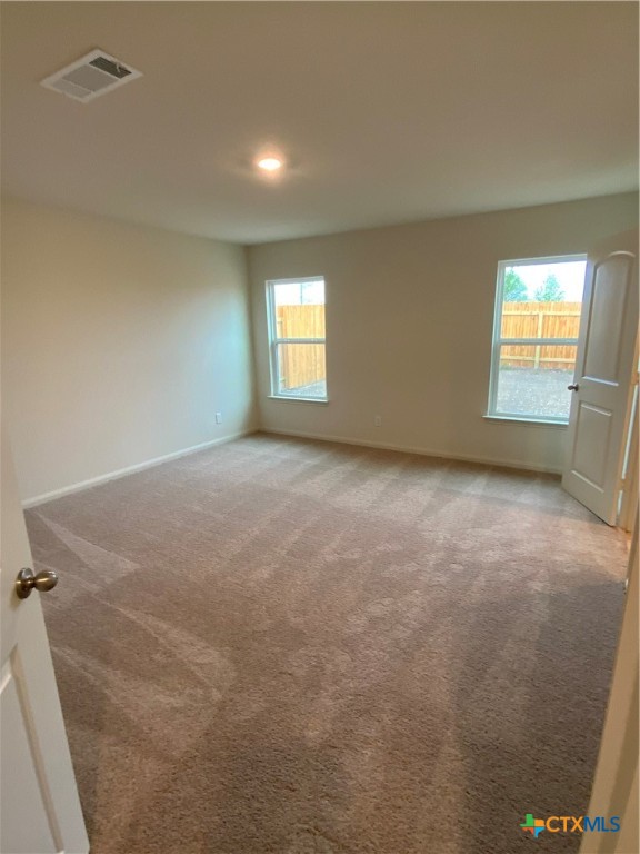 208 Allington Circle Jarrell, TX 76537 - Photo 9 of 16 an empty room with windows