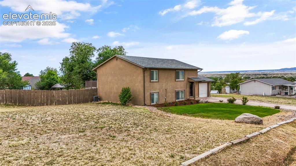 125 Diamond E Road Fountain, CO 80817 - Photo 5 of 43 a house view with a garden space