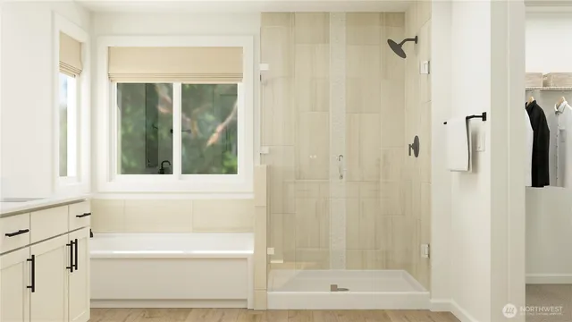 a bathroom with a bathtub and a shower