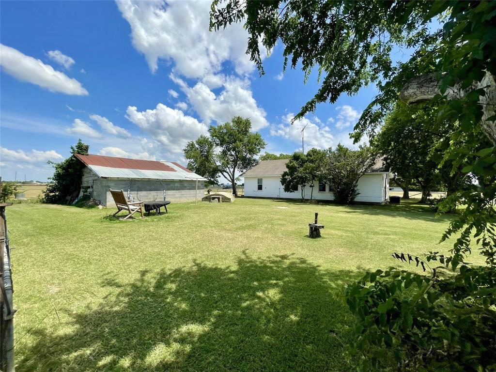 4969 Sam Bass Road Sanger, TX 76266 - Photo 4 of 5 The spacious backyard is perfect for relaxing and enjoying the outdoors.