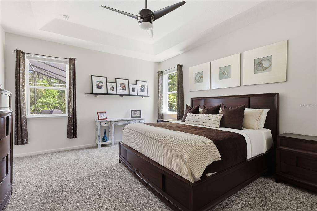 124 South Hummingbird Place Palm Coast, FL 32164 - Photo 12 of 47 a bed room with a bed and a window